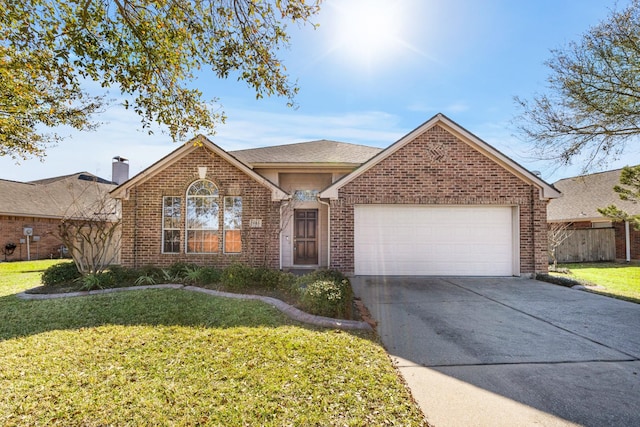 single story home featuring brick siding, a front lawn, fence, concrete driveway, and a garage