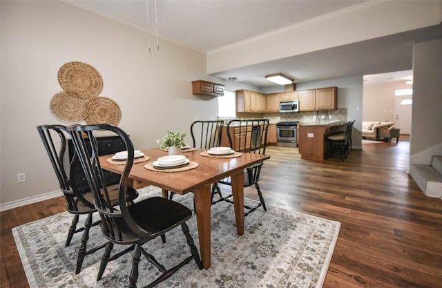 dining space featuring stairway, baseboards, crown molding, and wood finished floors