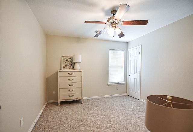 unfurnished bedroom with light carpet, ceiling fan, a closet, and baseboards