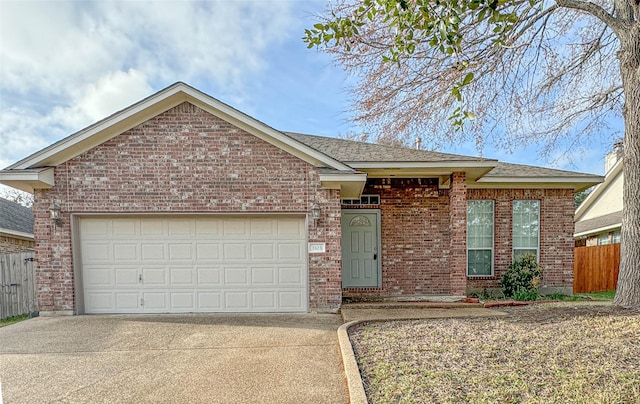 ranch-style home featuring an attached garage, driveway, fence, and brick siding