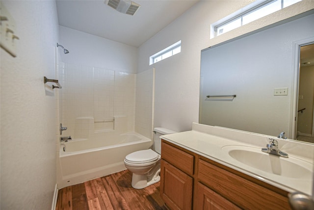 full bathroom with toilet, shower / bath combination, wood finished floors, vanity, and visible vents