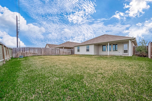 view of yard with a fenced backyard