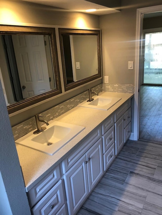 bathroom featuring double vanity and a sink