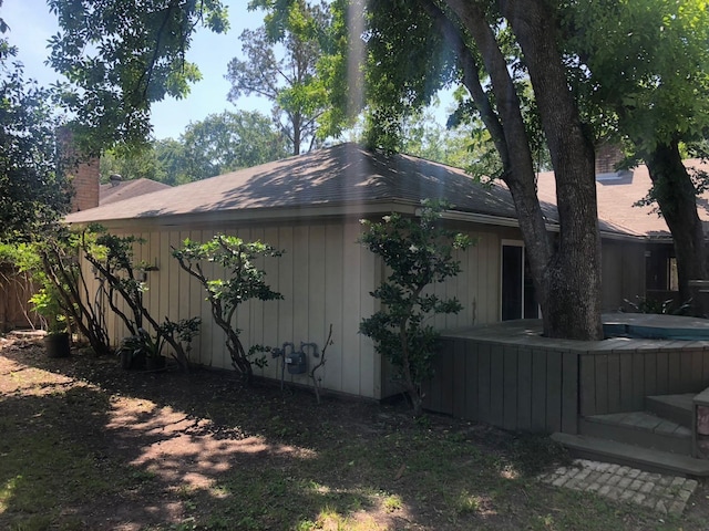 view of side of property with a chimney