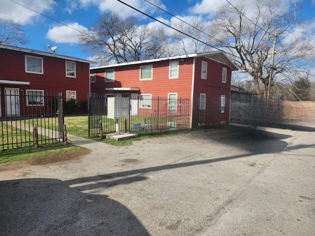 view of front of property featuring fence