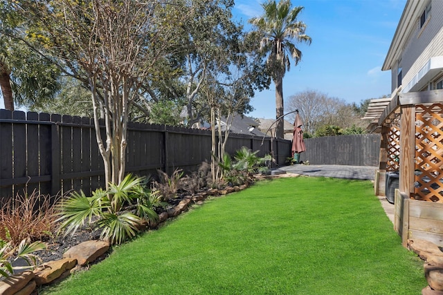 view of yard with a fenced backyard