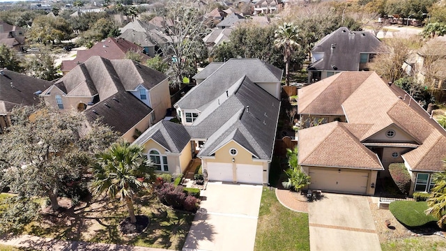 birds eye view of property with a residential view