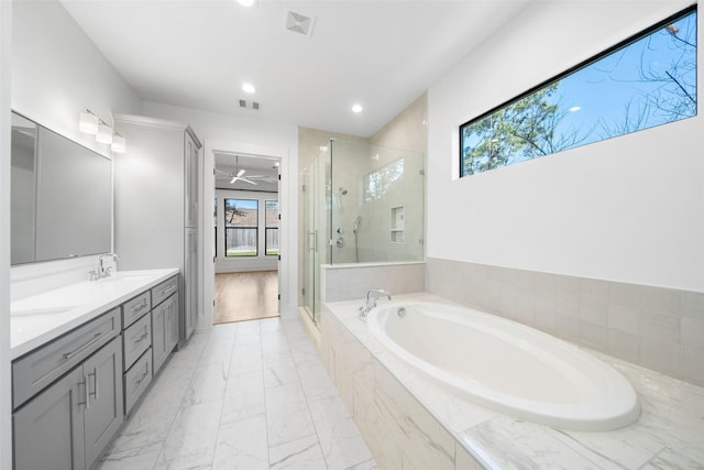 full bathroom with visible vents, a garden tub, a stall shower, marble finish floor, and a sink