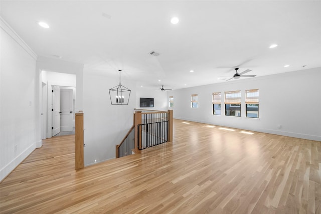 unfurnished living room featuring baseboards, recessed lighting, visible vents, and light wood-type flooring