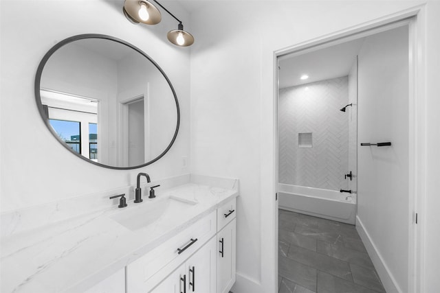 full bath featuring shower / bath combination, baseboards, and vanity