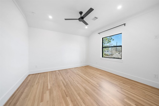 unfurnished room with ceiling fan, baseboards, visible vents, and light wood-type flooring