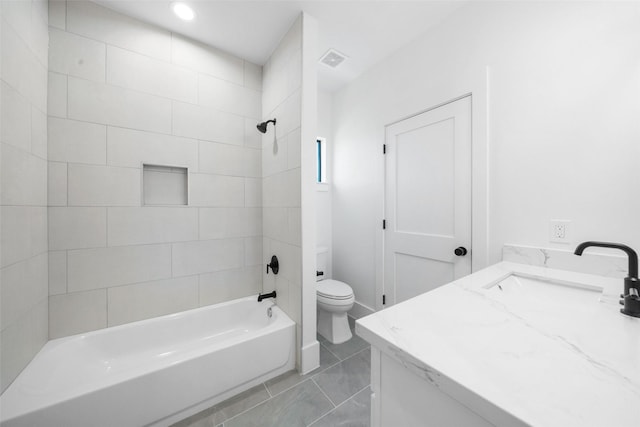 bathroom with vanity, toilet, tub / shower combination, and visible vents