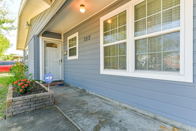 entrance to property with covered porch