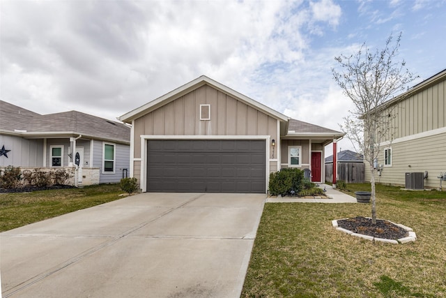 view of front of home featuring concrete driveway, central AC unit, board and batten siding, a garage, and a front lawn