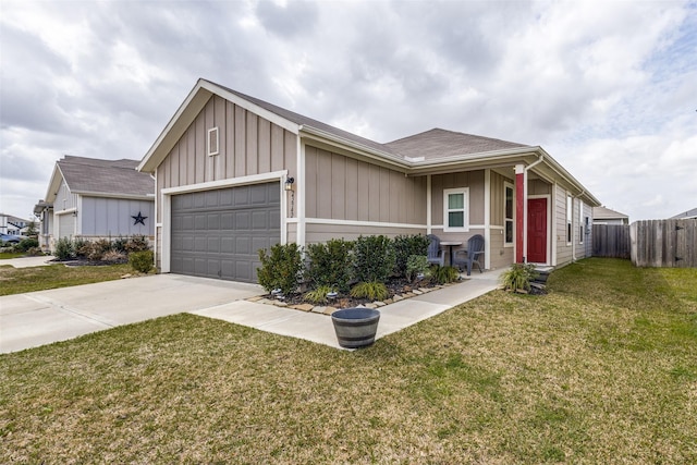 view of front of property with an attached garage, board and batten siding, fence, driveway, and a front lawn