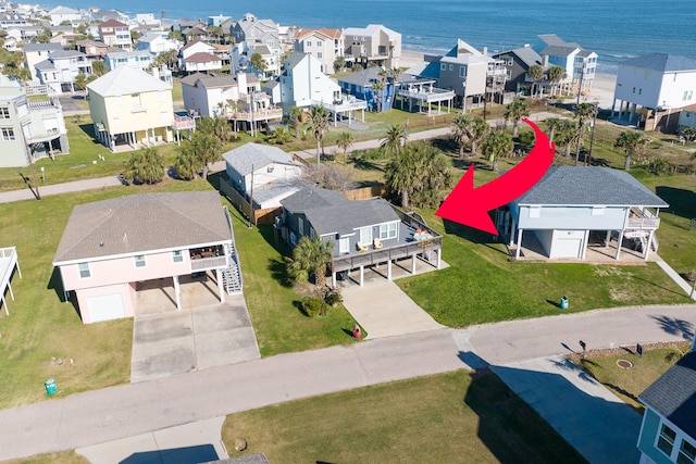 aerial view with a water view and a residential view