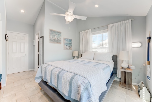 bedroom with lofted ceiling, ceiling fan, baseboards, and light tile patterned floors