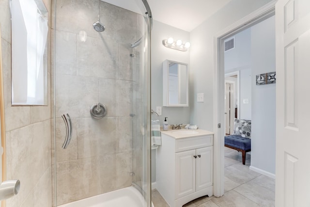 full bathroom with a shower stall, visible vents, and vanity