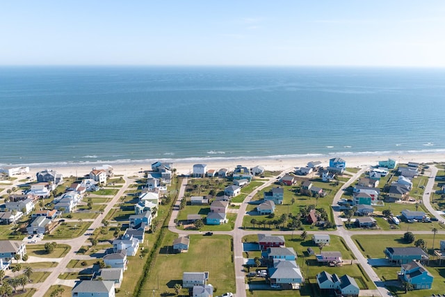 bird's eye view with a water view, a residential view, and a beach view