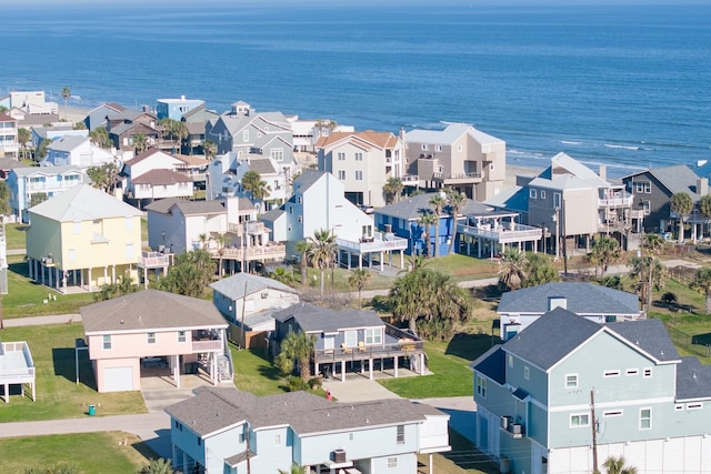 drone / aerial view featuring a water view and a residential view