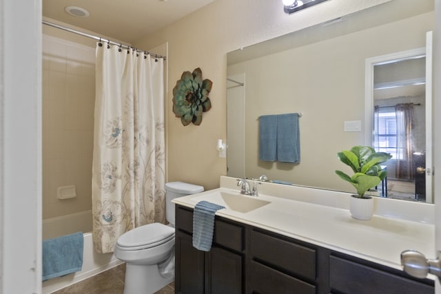 bathroom featuring tile patterned flooring, shower / bath combo with shower curtain, toilet, and vanity