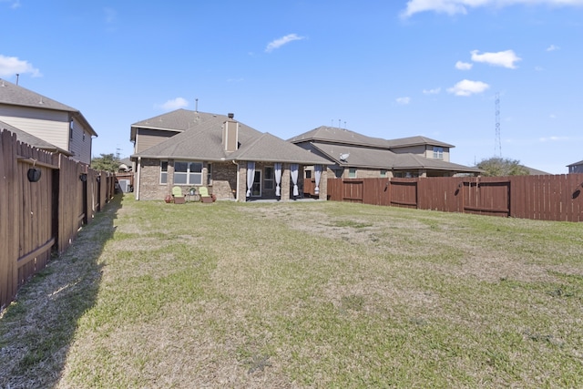 view of yard with a fenced backyard