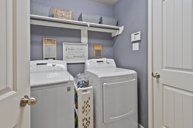 laundry area featuring washing machine and dryer and laundry area