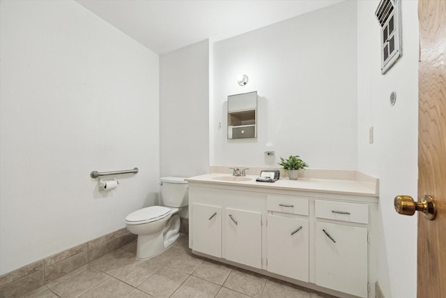 bathroom featuring toilet, vanity, and tile patterned floors