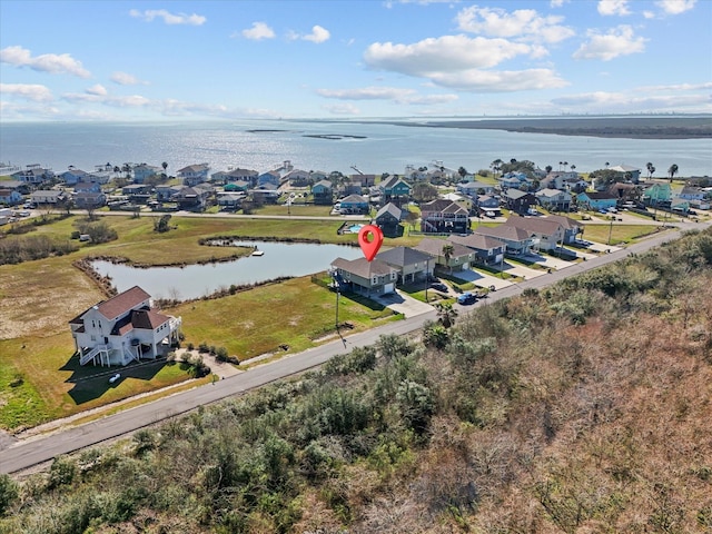 bird's eye view featuring a water view and a residential view