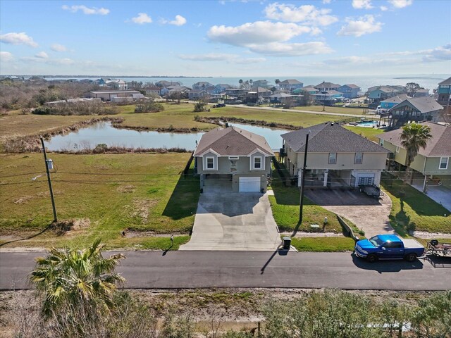 aerial view featuring a water view and a residential view