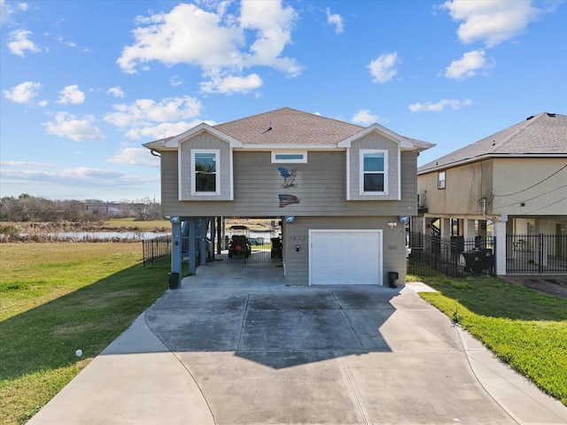 beach home featuring a carport, a garage, fence, and a front lawn