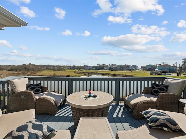 wooden deck featuring a water view