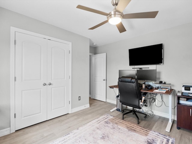 office with ceiling fan, baseboards, and wood finished floors