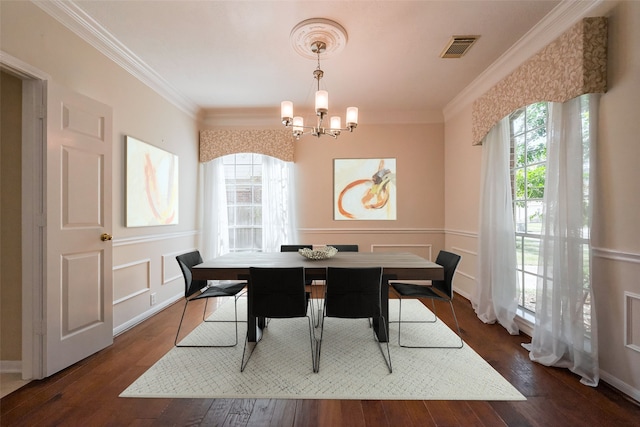 dining space with ornamental molding, a wealth of natural light, visible vents, and dark wood-style floors