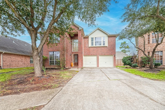 traditional-style house featuring brick siding, driveway, and an attached garage