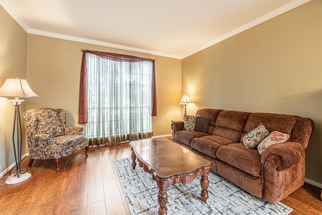 living room featuring ornamental molding, wood-type flooring, and baseboards