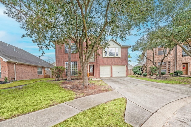 view of front of home with a garage, a front yard, concrete driveway, and brick siding