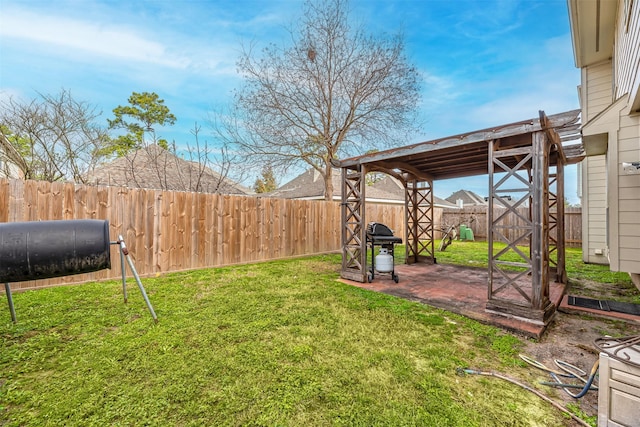 view of yard featuring a patio area and a fenced backyard