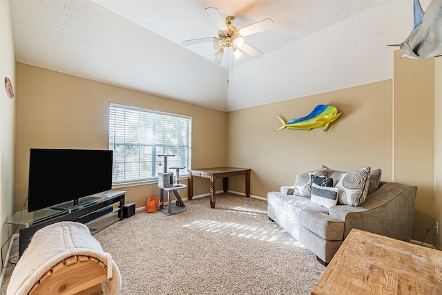 interior space with lofted ceiling, carpet, baseboards, and a ceiling fan