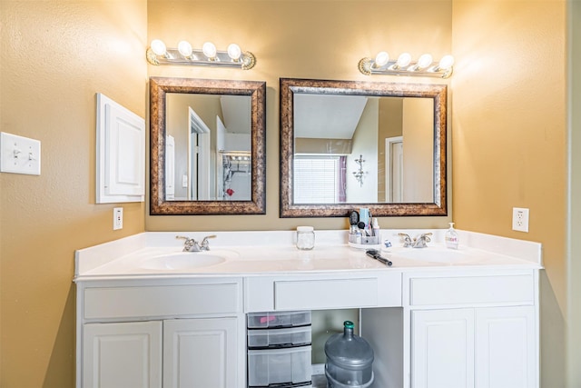 full bath featuring double vanity and a sink