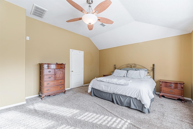 carpeted bedroom featuring visible vents, vaulted ceiling, and baseboards