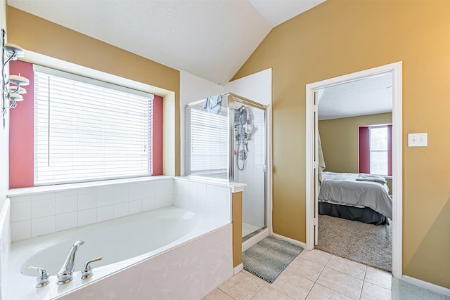 full bath with a garden tub, a stall shower, vaulted ceiling, ensuite bath, and tile patterned floors