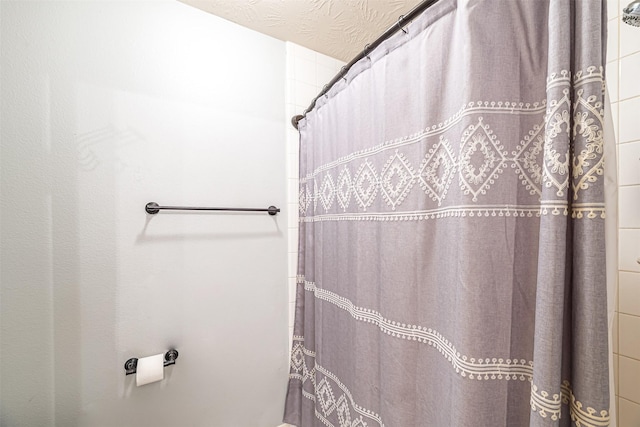 bathroom featuring a shower with curtain