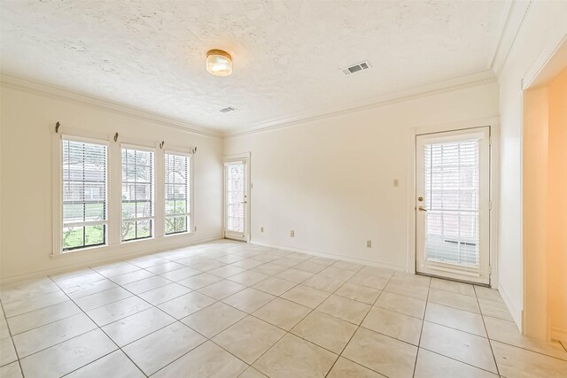 unfurnished room featuring ornamental molding, visible vents, a textured ceiling, and light tile patterned flooring