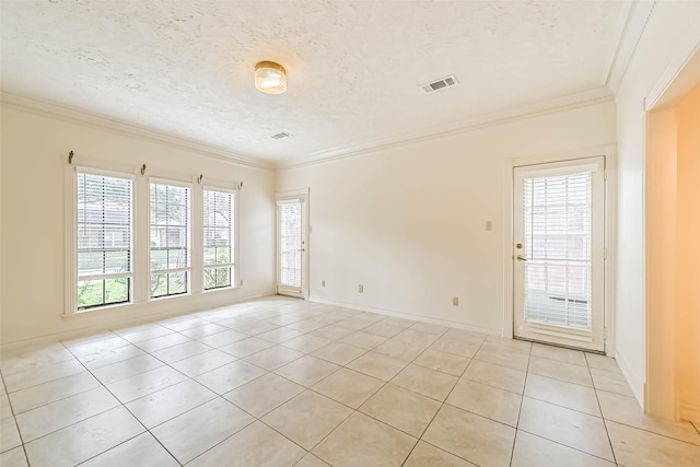 empty room with ornamental molding, baseboards, visible vents, and light tile patterned floors