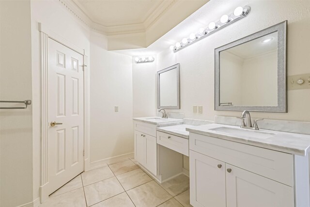 bathroom with double vanity, ornamental molding, a sink, and tile patterned floors