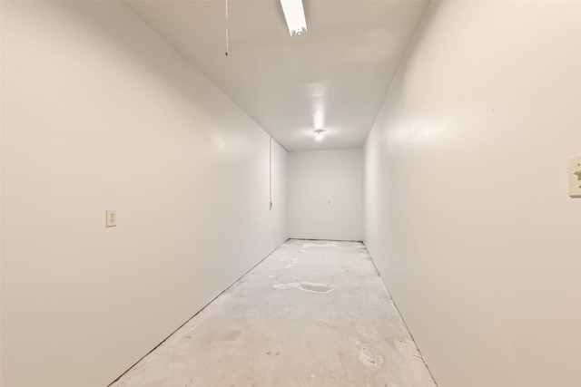 corridor featuring concrete flooring