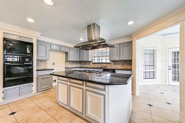 kitchen with light tile patterned floors, island range hood, gray cabinets, crown molding, and black appliances