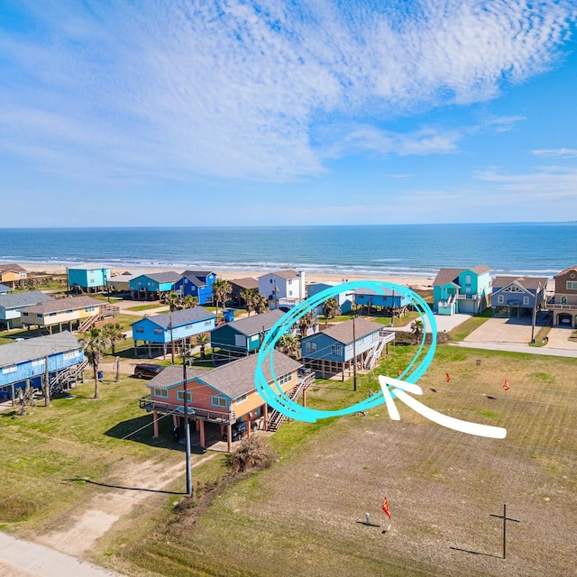 drone / aerial view featuring a water view and a residential view