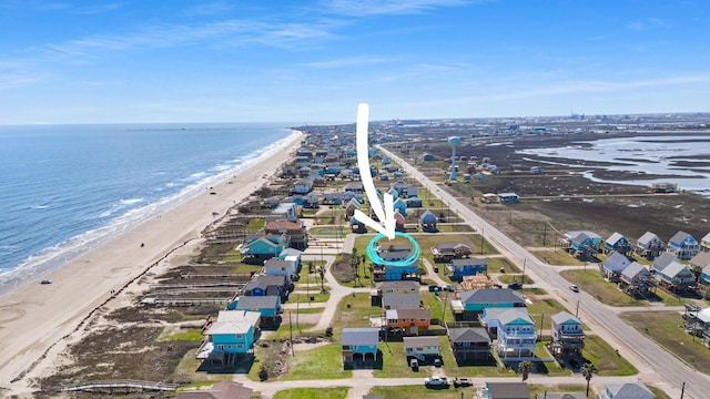 bird's eye view featuring a water view and a view of the beach